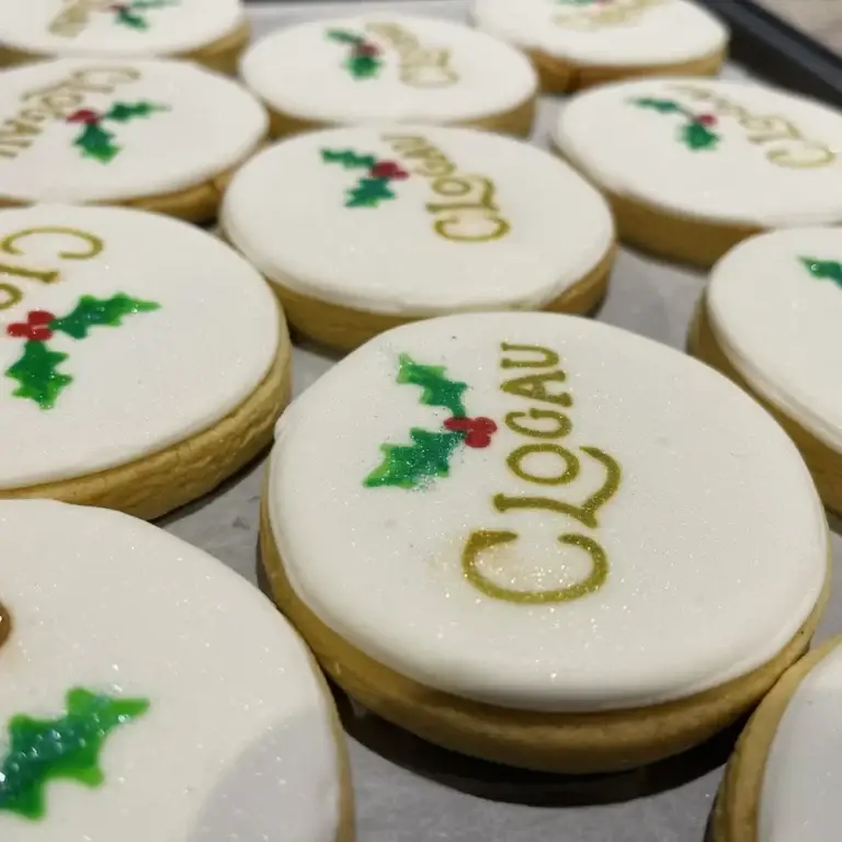 Hand-iced biscuits made for Clogau